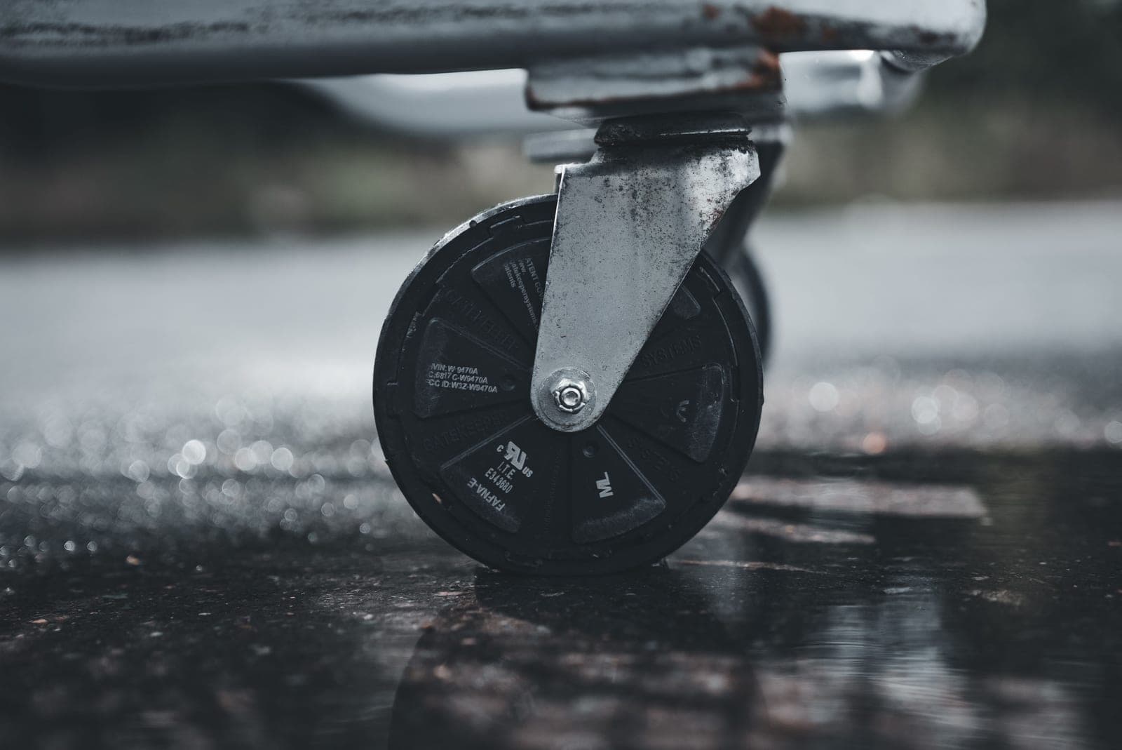 A close-up of a heavy-duty metal caster wheel