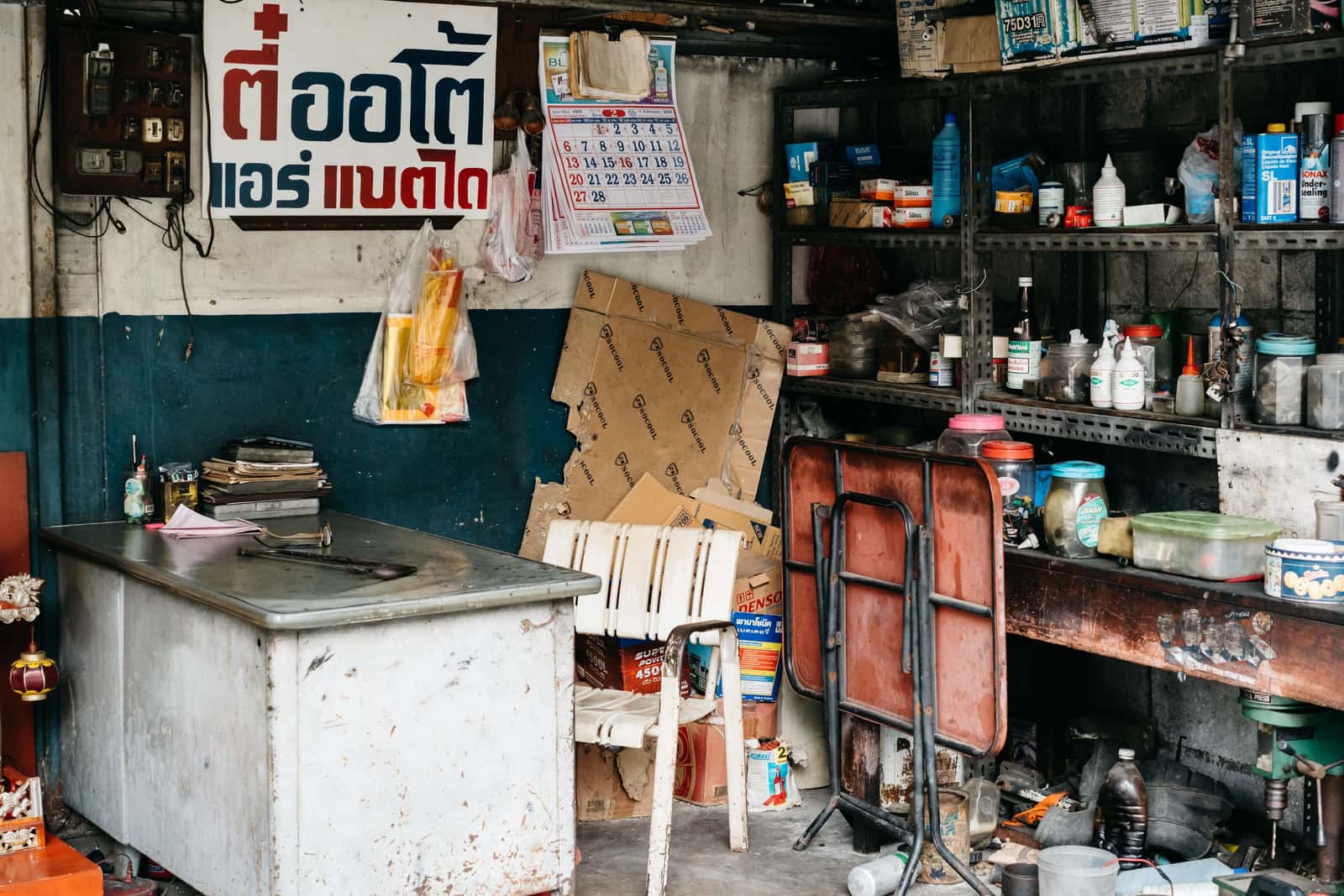 A working garage with tools, shelving and a bench in daily use