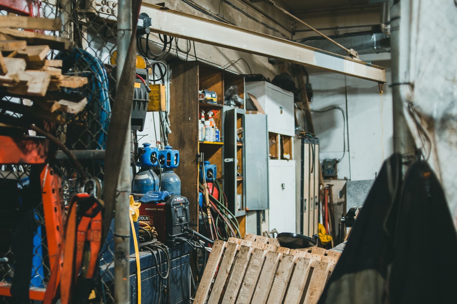 The inside of a busy workshop filled with tools and equipment