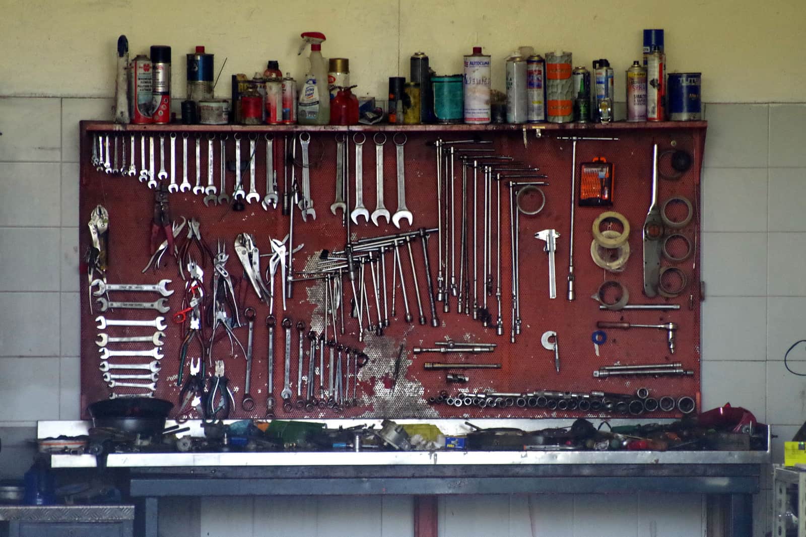 Workshop tools hung in order across a pegboard wall